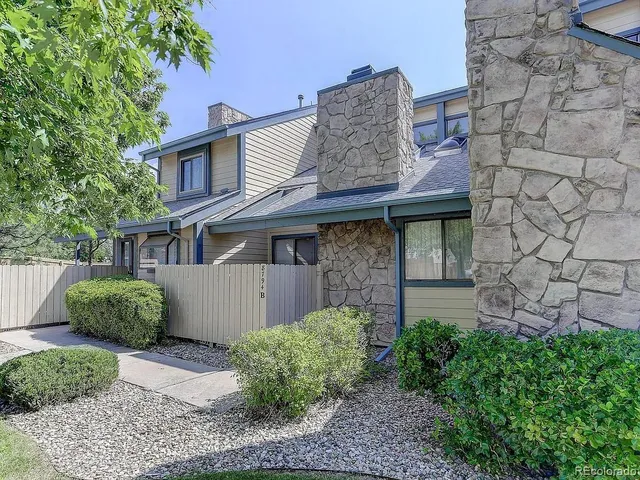a view of a house with a yard and plants