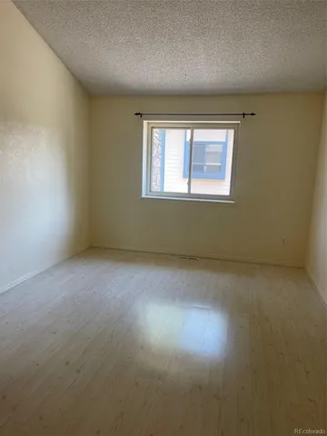 an empty room with closet area