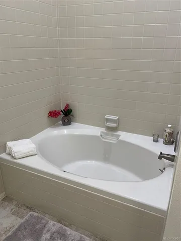 a bathroom with a potted plant and a sink