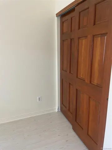 a bathroom with a sink a toilet a mirror and shower