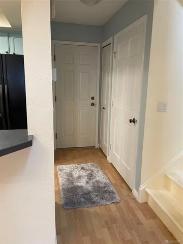 a view of a backyard with a wooden fence