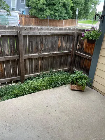 a view of a park with trees and flowers
