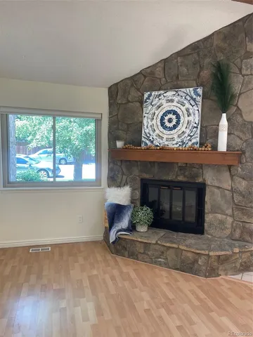 a wooden floor with a fireplace