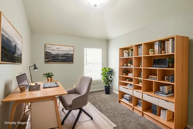 a workspace with furniture and bookshelf