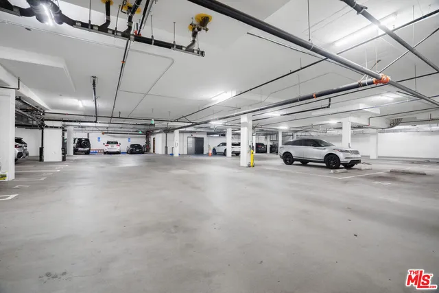 a view of parking space with parked cars