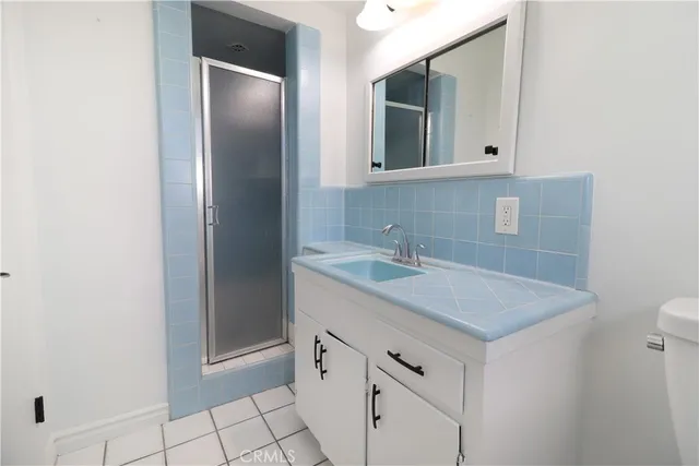 a bathroom with a sink a vanity and a mirror