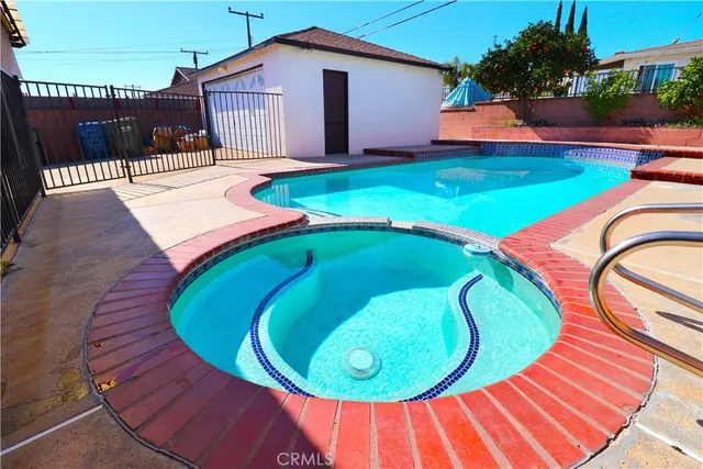 a view of swimming pool in a backyard