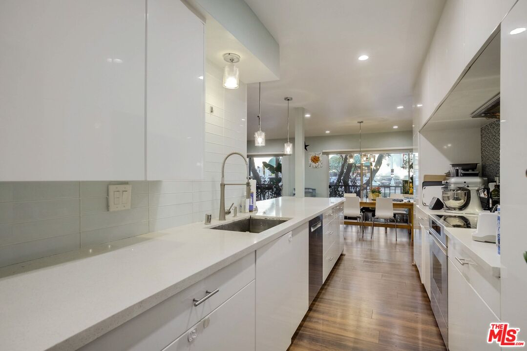 1045 North Kings Road, Unit 102 West Hollywood, CA 90069 - Photo 6 of 15 a kitchen with lots of counter top space