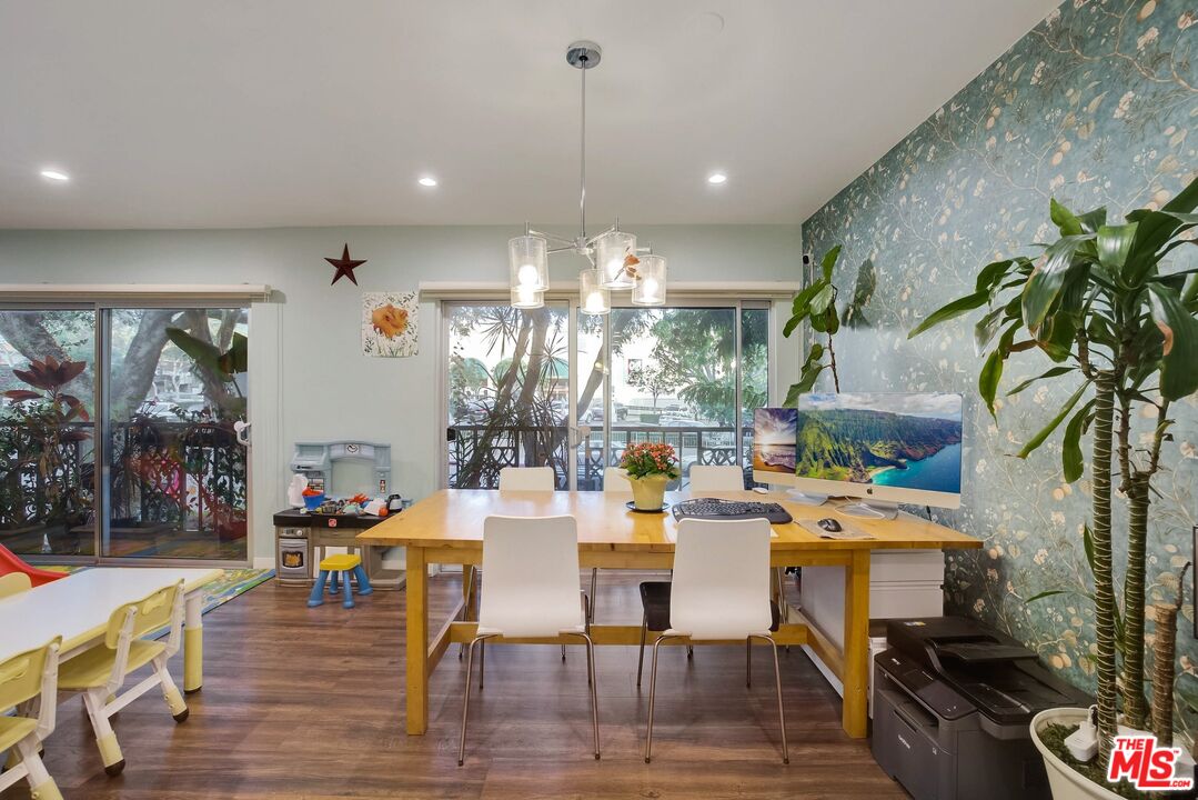 1045 North Kings Road, Unit 102 West Hollywood, CA 90069 - Photo 8 of 15 a outdoor space with lots of furniture and a chandelier