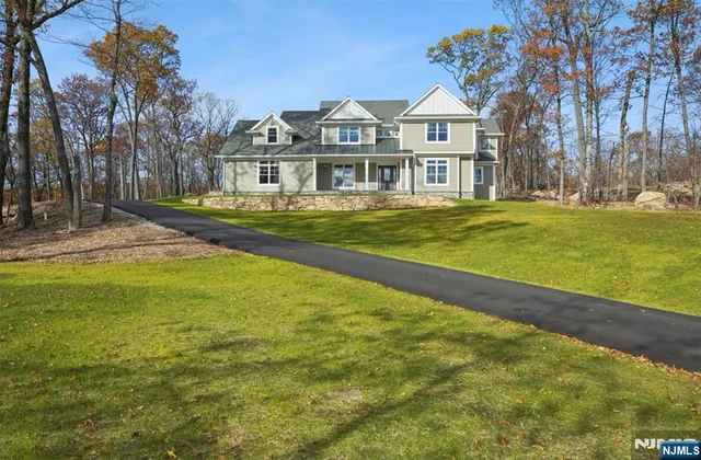 a front view of a house with swimming pool