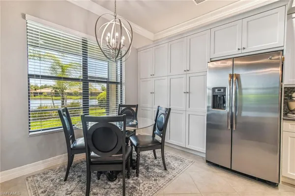 a view of a dining room with furniture window and chandelier
