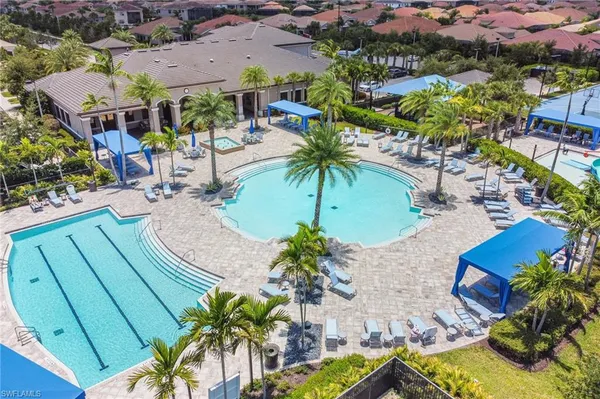 an aerial view of a house with garden space and lake view