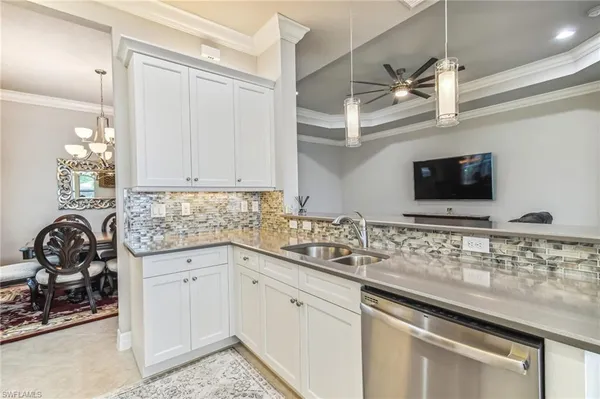 a kitchen with a sink and cabinets