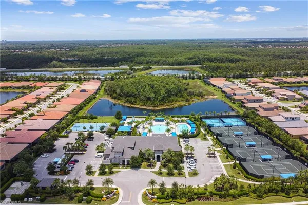 an aerial view of residential houses and outdoor space