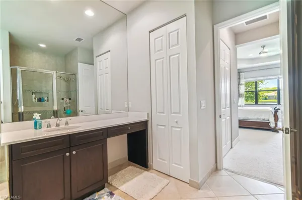 a bathroom with a double vanity sink and mirror