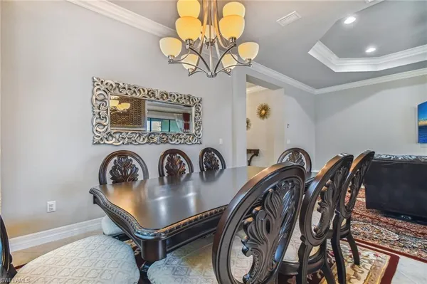 a very nice looking dining room with a table and chairs