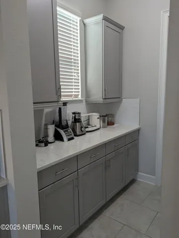 a kitchen with a sink and refrigerator