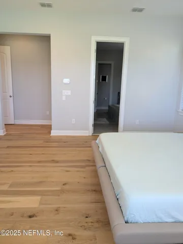 a room with a sink and a refrigerator