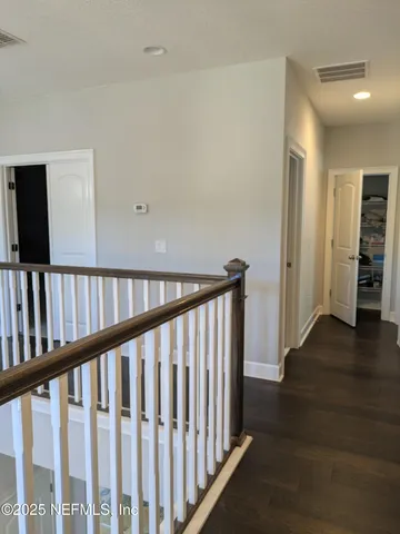 a bedroom with a bed and a sink