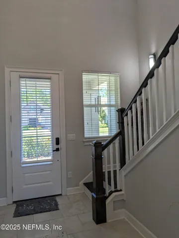 a view of a hallway with windows