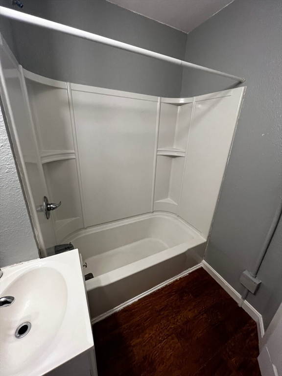 691 State Street Springfield, MA 01109 - Photo 15 of 18 a bathroom with a bathtub and a shower