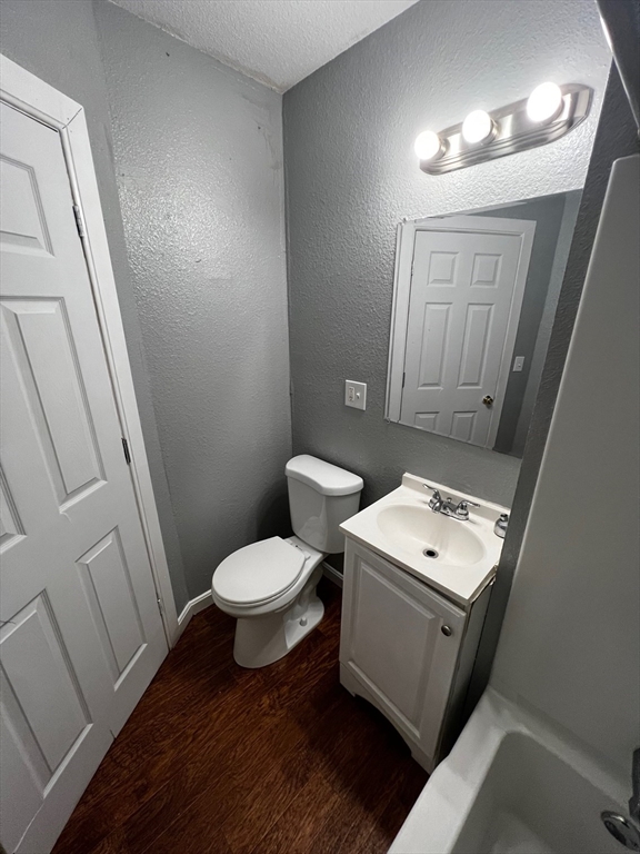 691 State Street Springfield, MA 01109 - Photo 16 of 18 a bathroom with a toilet sink and mirror