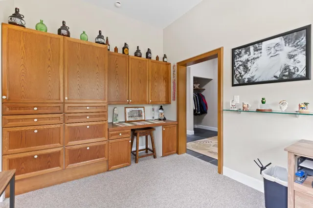 a kitchen with stainless steel appliances a cabinets and a living room view