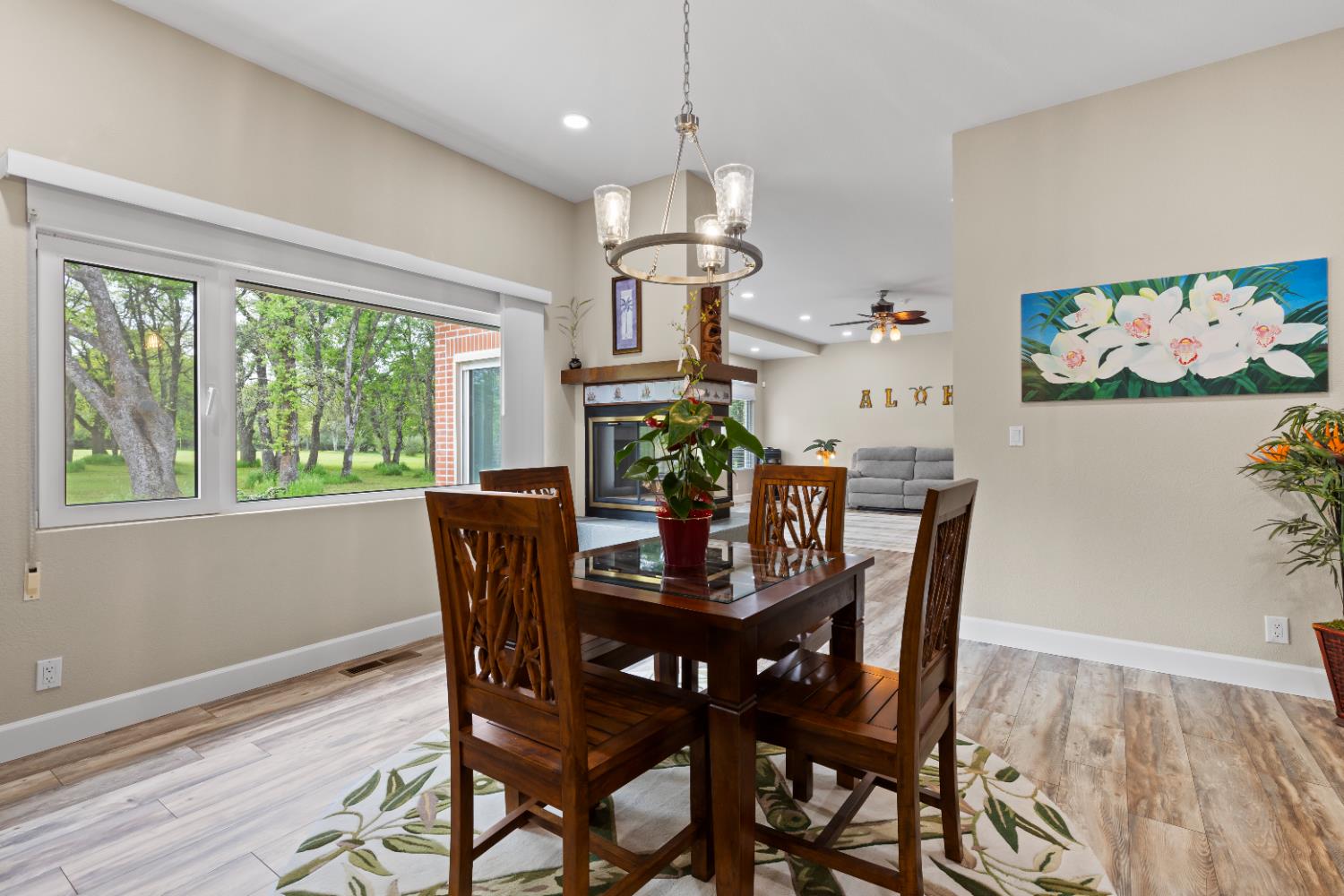 1222 Fruitvale Road Lincoln, CA 95648 - Photo 27 of 90 a view of a dining room with furniture a chandelier and wooden floor