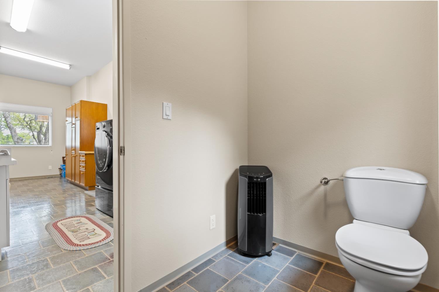 1222 Fruitvale Road Lincoln, CA 95648 - Photo 37 of 90 a white toilet sitting next to a bathroom sink