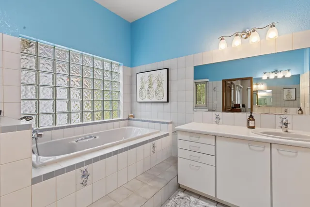 a view of a house with a yard and tree s