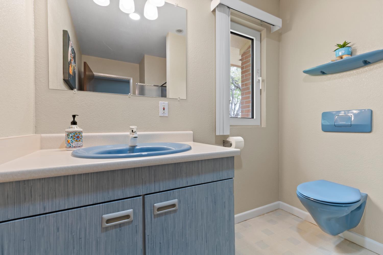 1222 Fruitvale Road Lincoln, CA 95648 - Photo 64 of 90 a bathroom with a toilet a sink and mirror