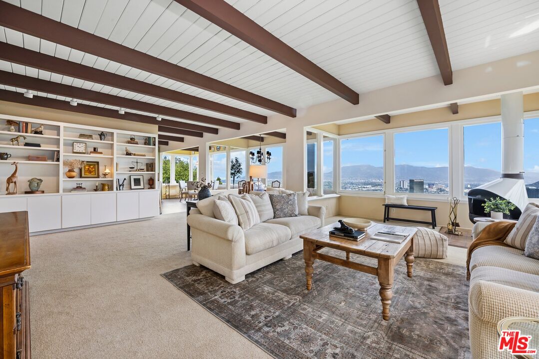 3230 Wrightwood Drive Studio City, CA 91604 - Photo 1 of 43 a living room with furniture and a large window