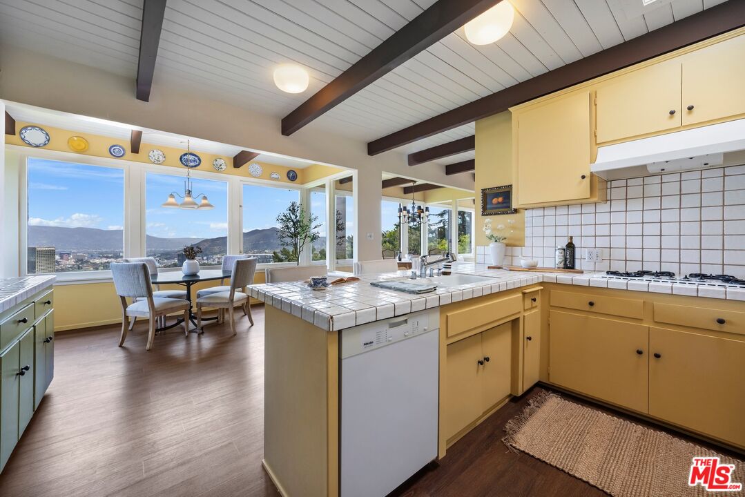 3230 Wrightwood Drive Studio City, CA 91604 - Photo 11 of 43 a kitchen with a sink and living room
