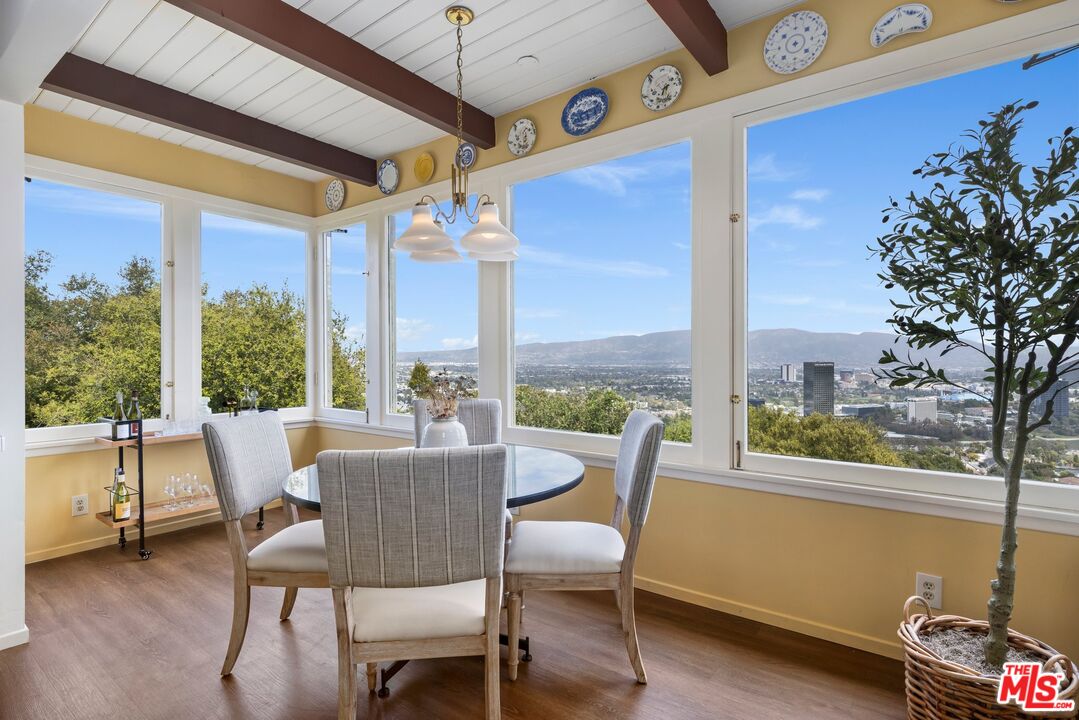 3230 Wrightwood Drive Studio City, CA 91604 - Photo 12 of 43 a dining room with furniture water view and a floor to ceiling window