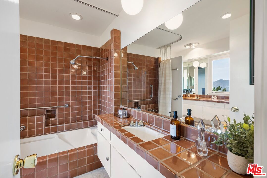3230 Wrightwood Drive Studio City, CA 91604 - Photo 22 of 43 a bathroom with a tub sink and mirror