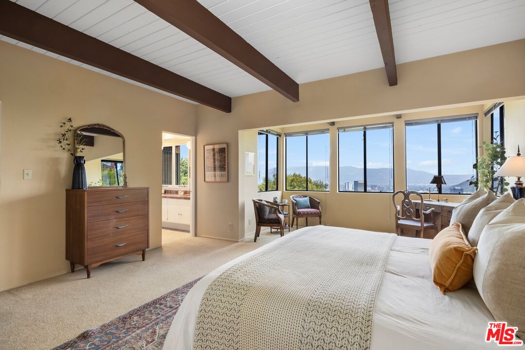 3230 Wrightwood Drive Studio City, CA 91604 - Photo 24 of 43 a large bedroom with a bed and large windows