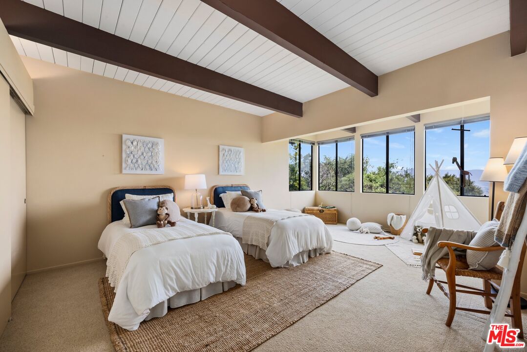 3230 Wrightwood Drive Studio City, CA 91604 - Photo 26 of 43 a bedroom with two beds and large windows