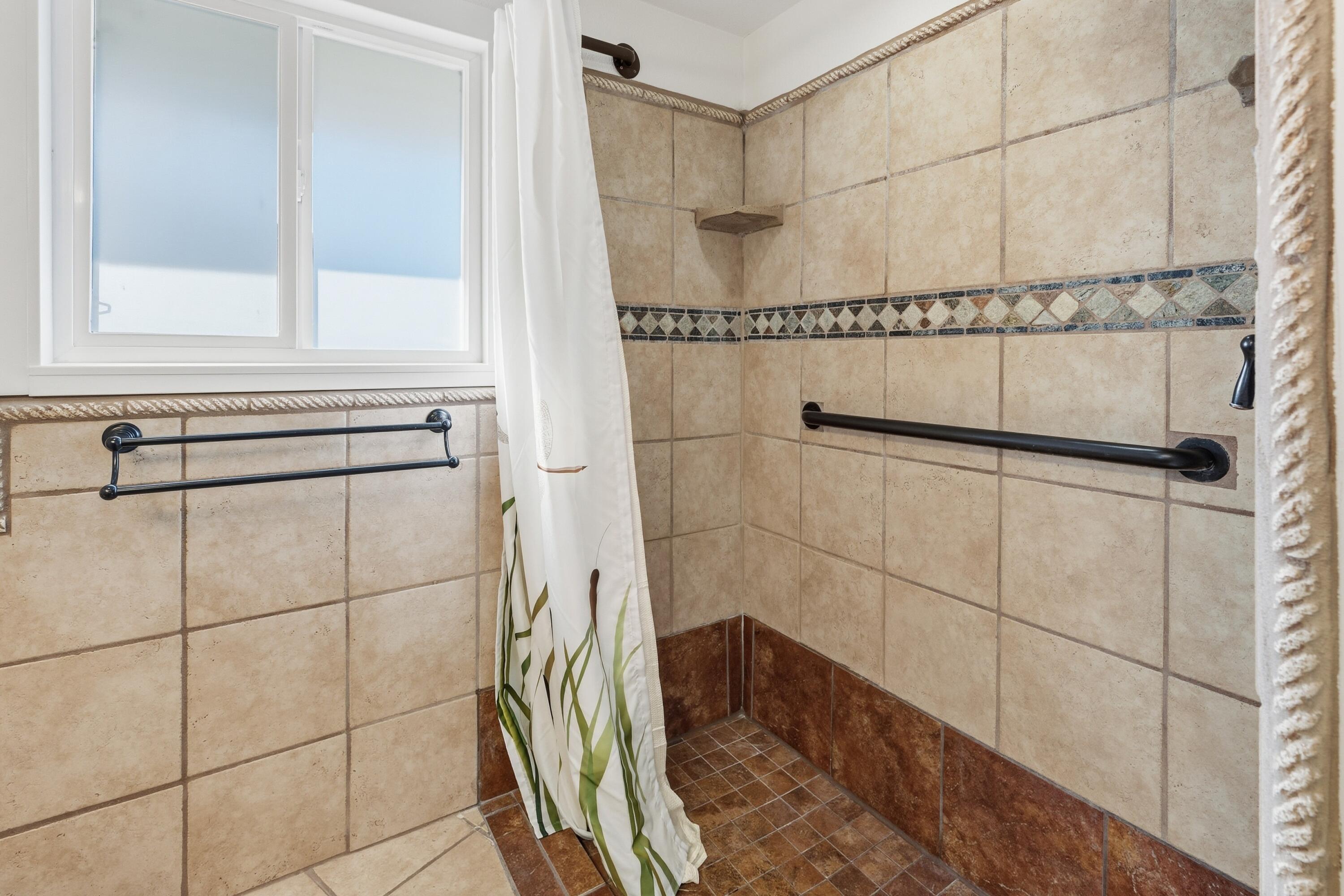 4074 Southwest Reif Road Powell Butte, OR 97753 - Photo 23 of 59 a bathroom with a bathtub and shower