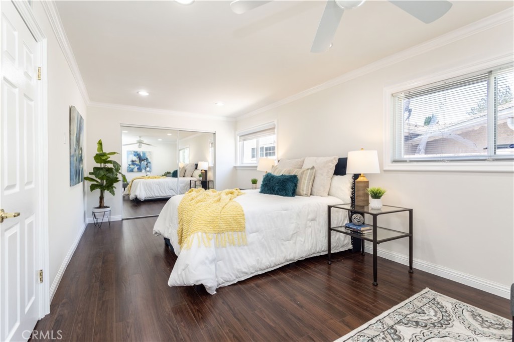 18308 Lahey Street Porter Ranch, CA 91326 - Photo 15 of 41 a bedroom with a bed and wooden floor