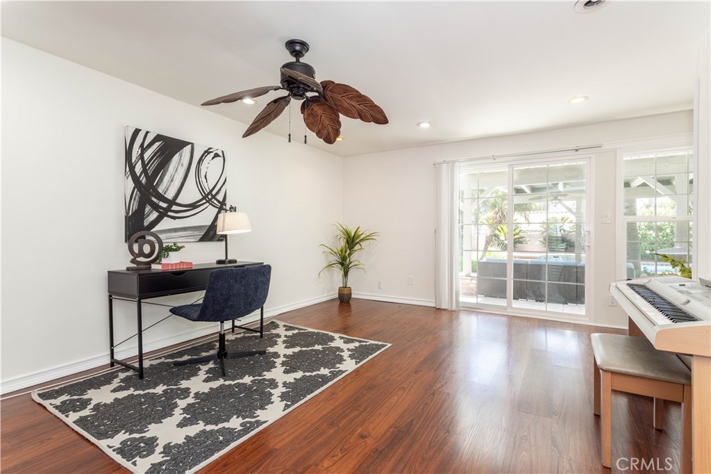 18308 Lahey Street Porter Ranch, CA 91326 - Photo 18 of 41 a living room with furniture and a wooden floor