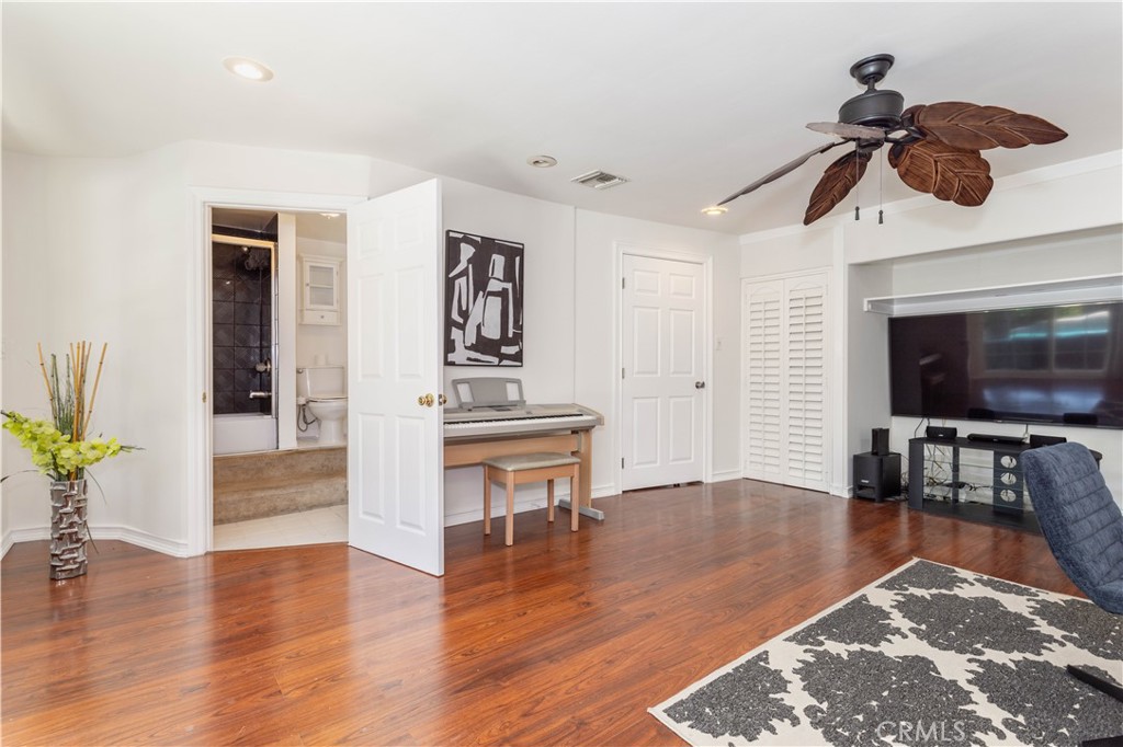 18308 Lahey Street Porter Ranch, CA 91326 - Photo 19 of 41 a living room with furniture and a flat screen tv