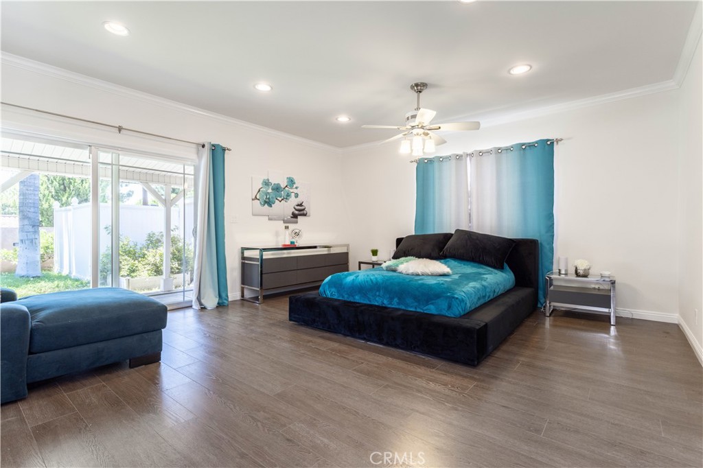 18308 Lahey Street Porter Ranch, CA 91326 - Photo 20 of 41 a bedroom with a bed window and couch