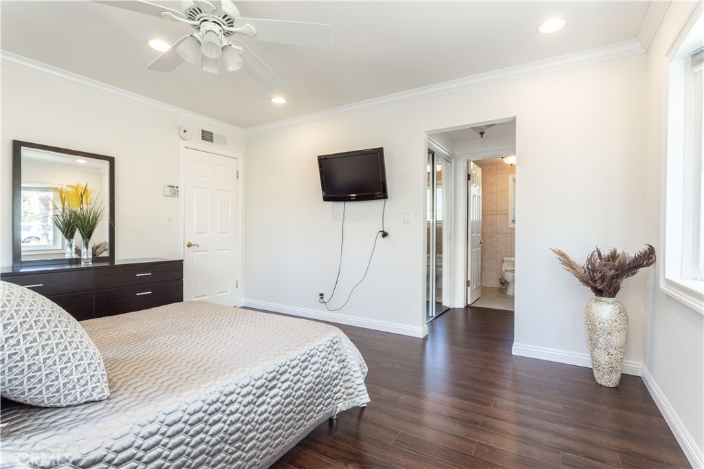18308 Lahey Street Porter Ranch, CA 91326 - Photo 22 of 41 a bedroom with furniture and a flat screen tv