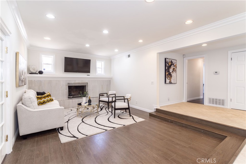 18308 Lahey Street Porter Ranch, CA 91326 - Photo 3 of 41 a living room with furniture and a fireplace