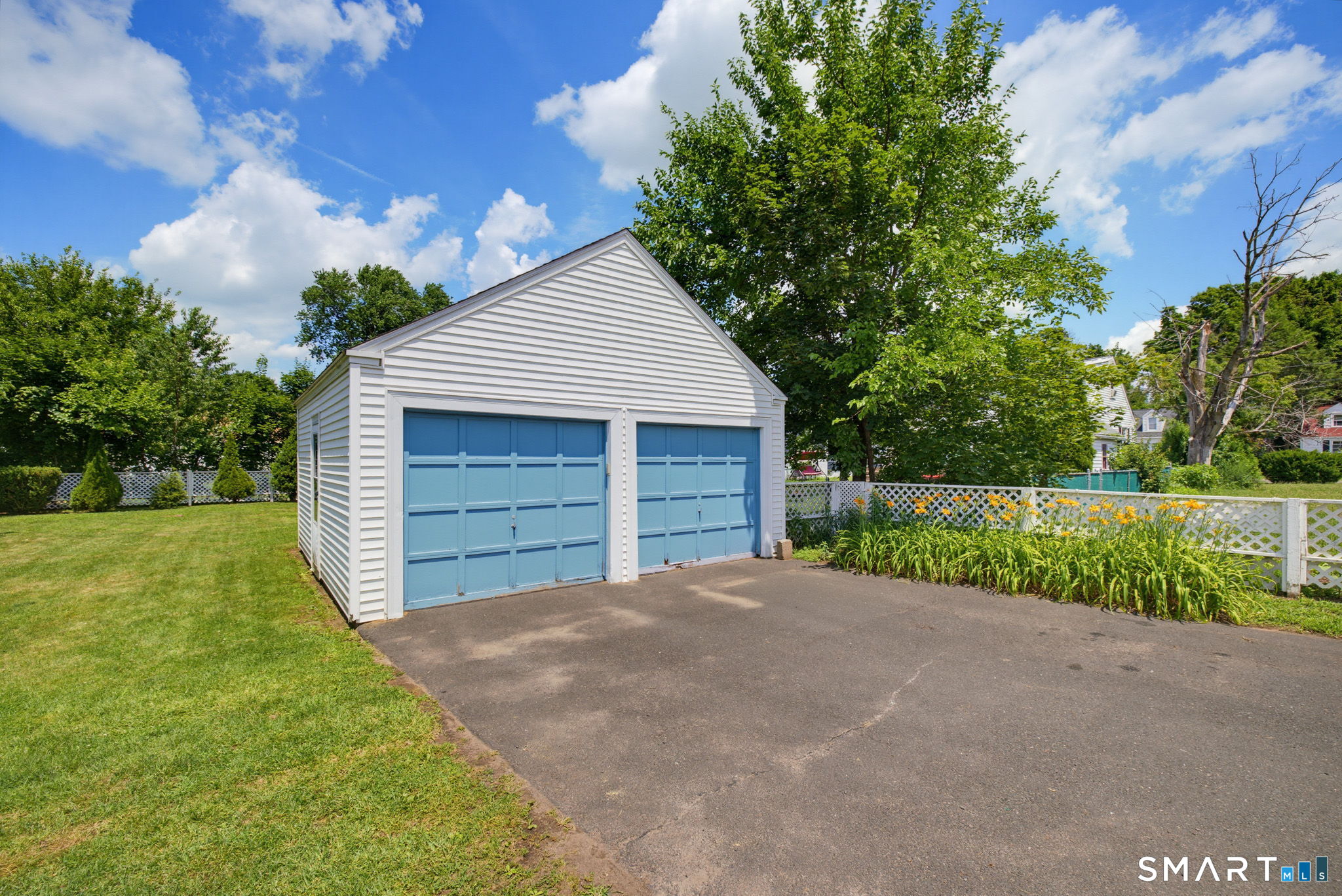 417 Hartford Road Manchester, CT 06040 - Photo 33 of 38 Detached 2 car garage with auto garage door opener. Also has a side door entry.