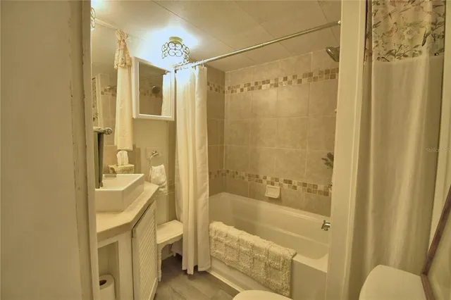 a bathroom with a glass door shower