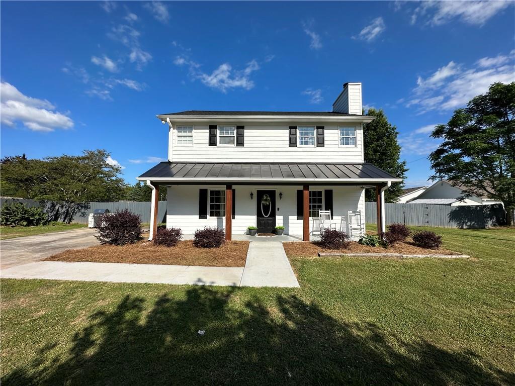 531 Chicken Lyle Road Winder, GA 30680 - Photo 1 of 1 a front view of a building with a garden