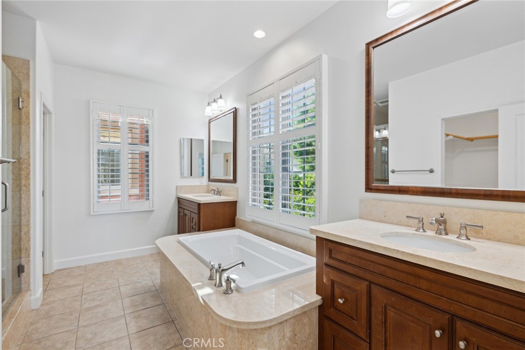 40 Lupari Irvine, CA 92618 - Photo 17 of 56 a bathroom with a sink double vanity and tub