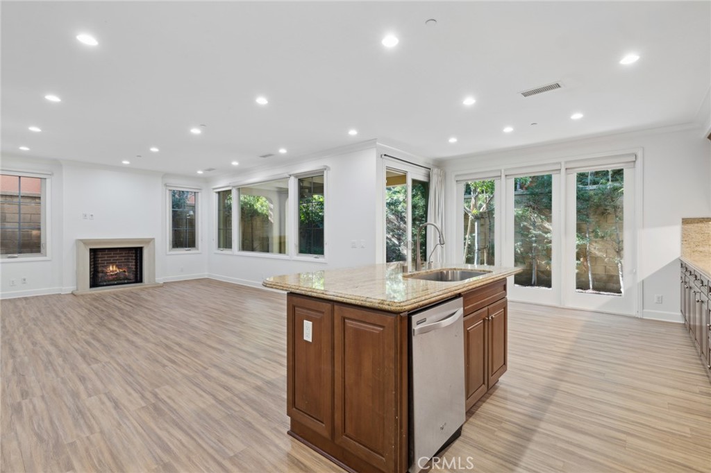 40 Lupari Irvine, CA 92618 - Photo 2 of 56 a kitchen with granite countertop a stove and a wooden floors