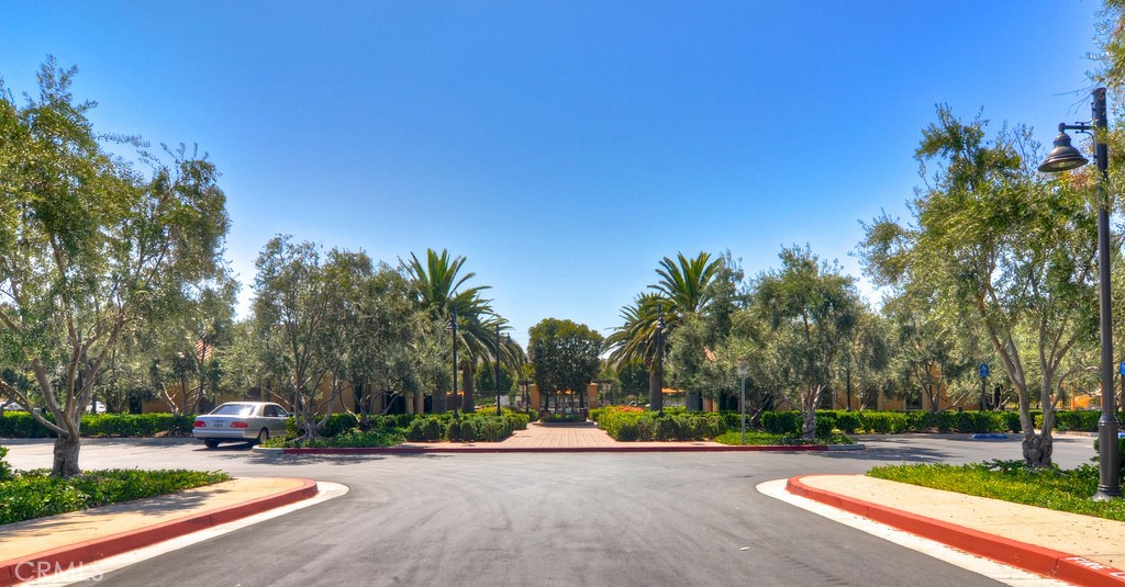 40 Lupari Irvine, CA 92618 - Photo 29 of 56 a view of a street with a building and trees in the background